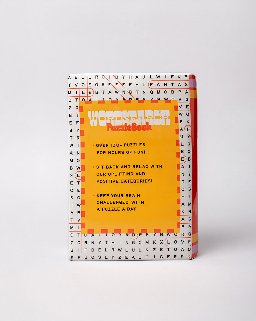 back view of pink word search puzzle book shaped ceramic vase