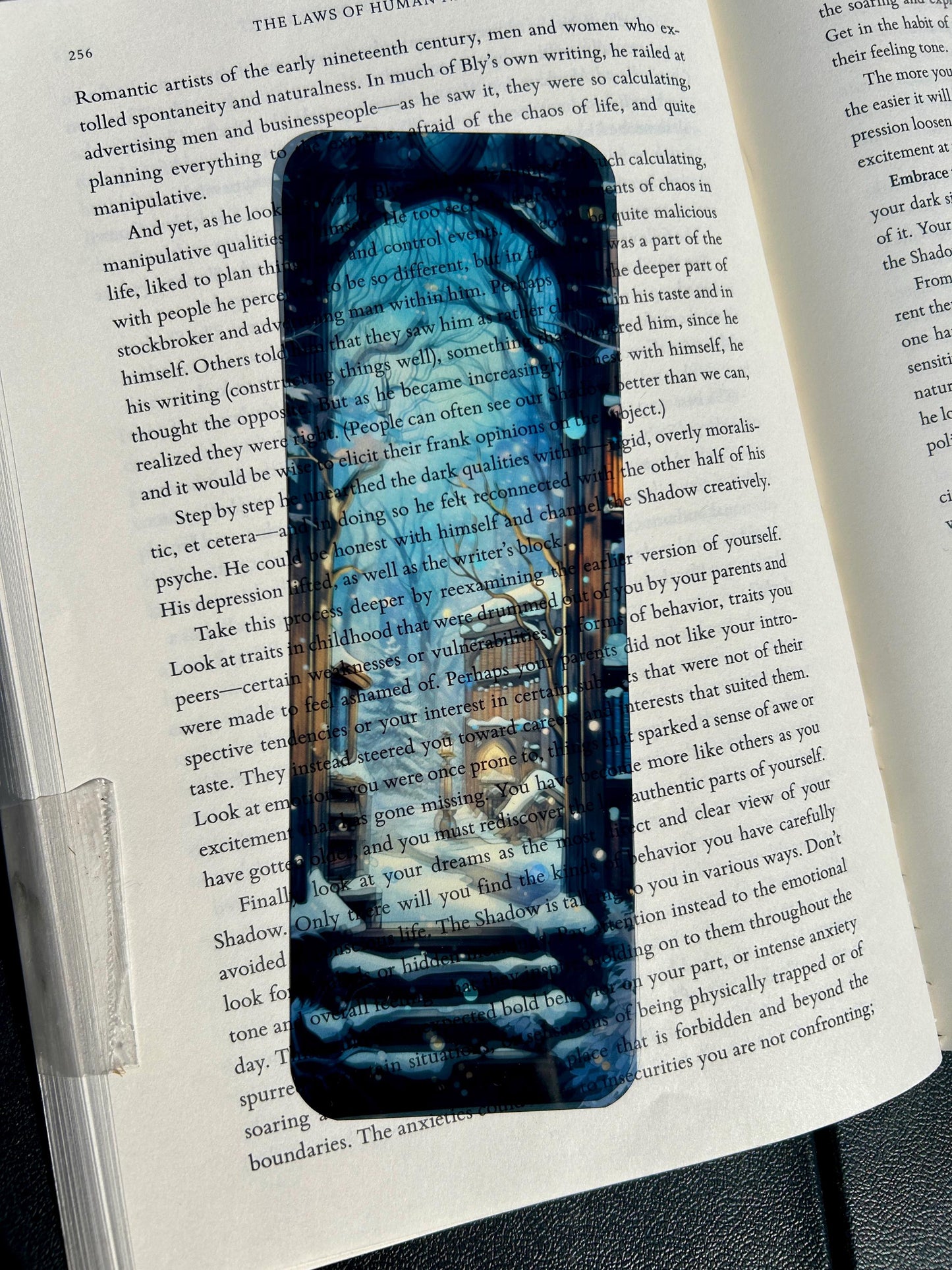 Snowy winter library bookmark with glowing bookshelves, enchanted trees, and magical snowfall through a gothic window