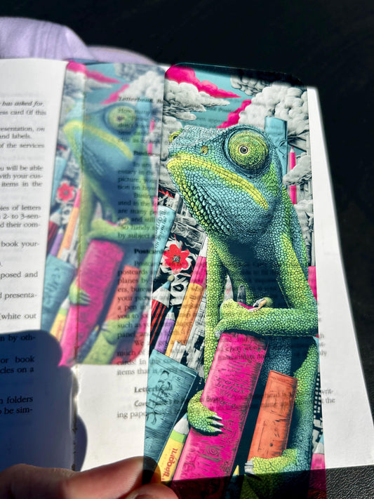 Chameleon Bookmark on Surreal Books and Charcoal Sky – Vibrant Fantasy Art for Creative Readers, Artists