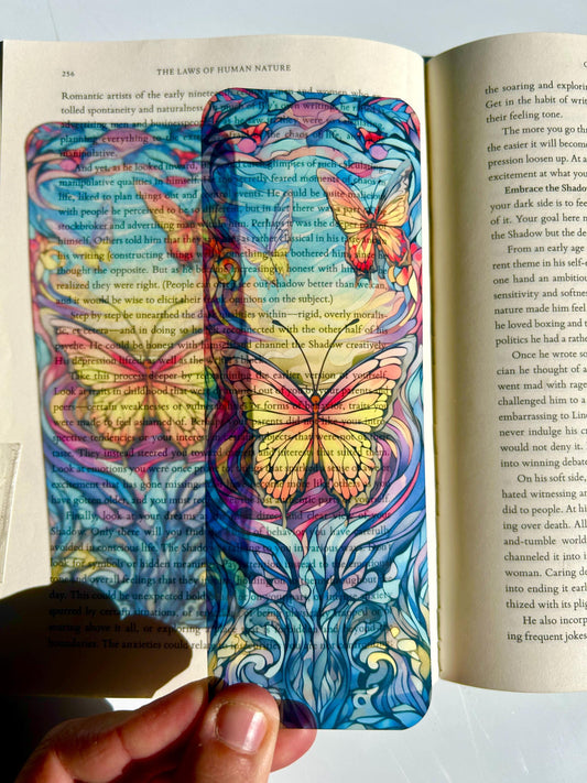 Stained glass butterfly bookmark in radiant sunset hues, vivid colors with floral accents, vibrant fantasy nature bookmark