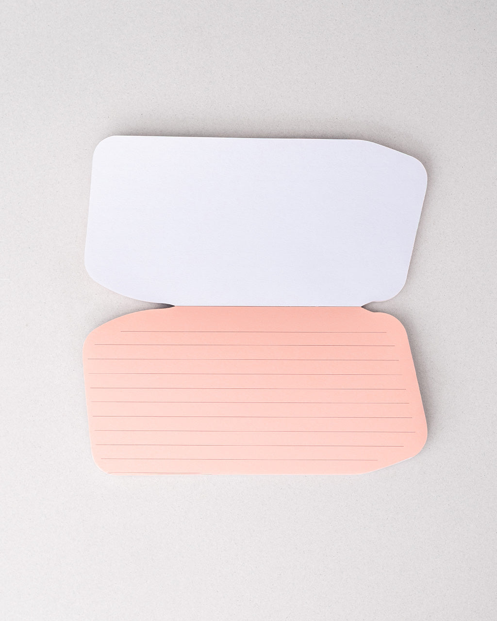 pink interior pages of realistic eraser notepad with 'enjoy the messy parts' across the front