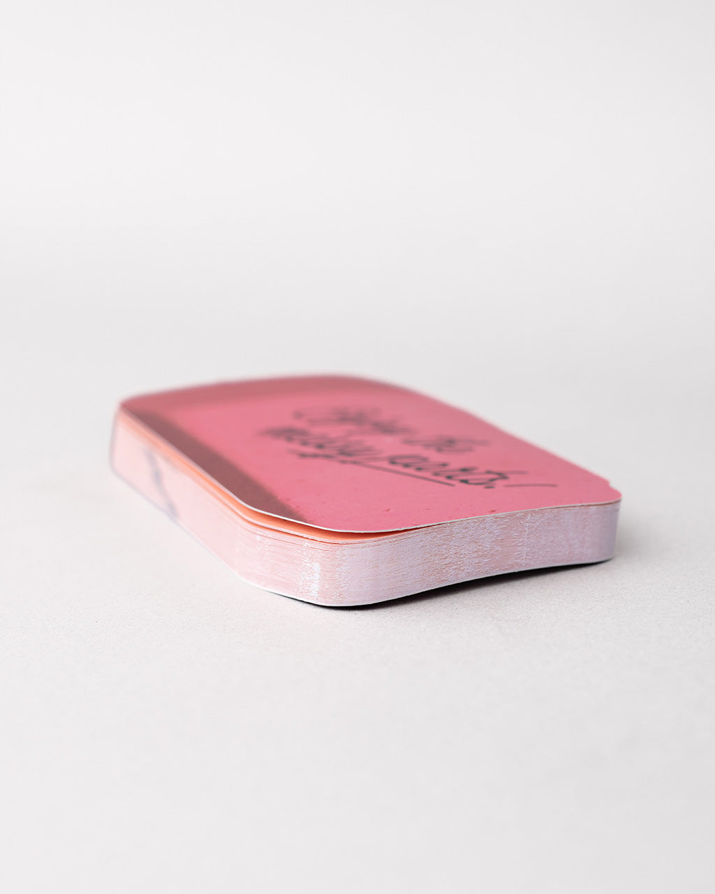 side view of realistic eraser notepad with 'enjoy the messy parts' across the front