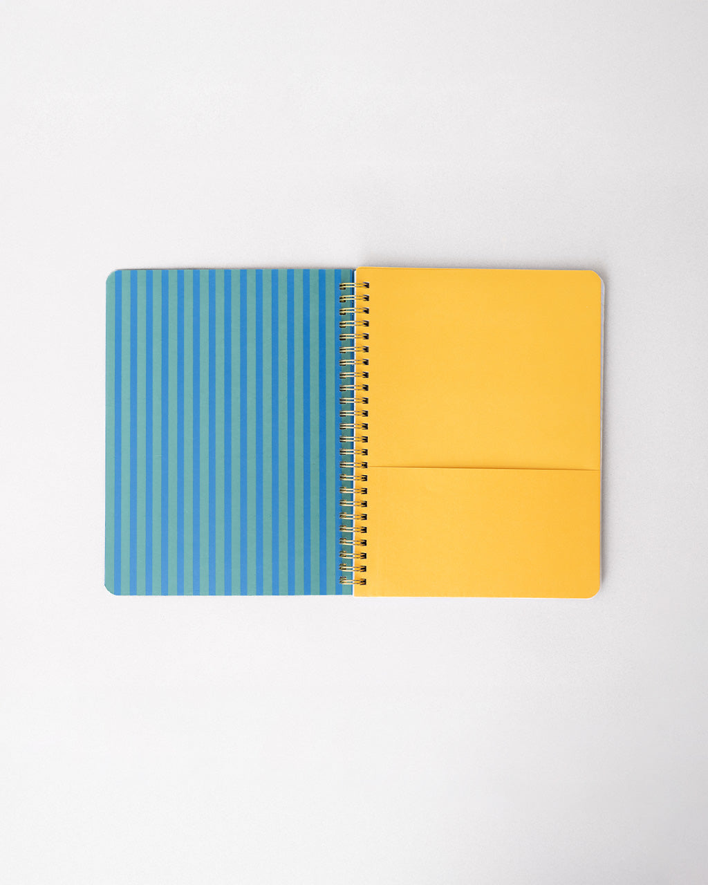interior green and blue vertical stripe cover and yellow pocket folder