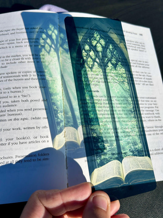 Bible Bookmark – Stained Glass Window Arch with Green Canopy & Glowing Light Over Ancient Open Book