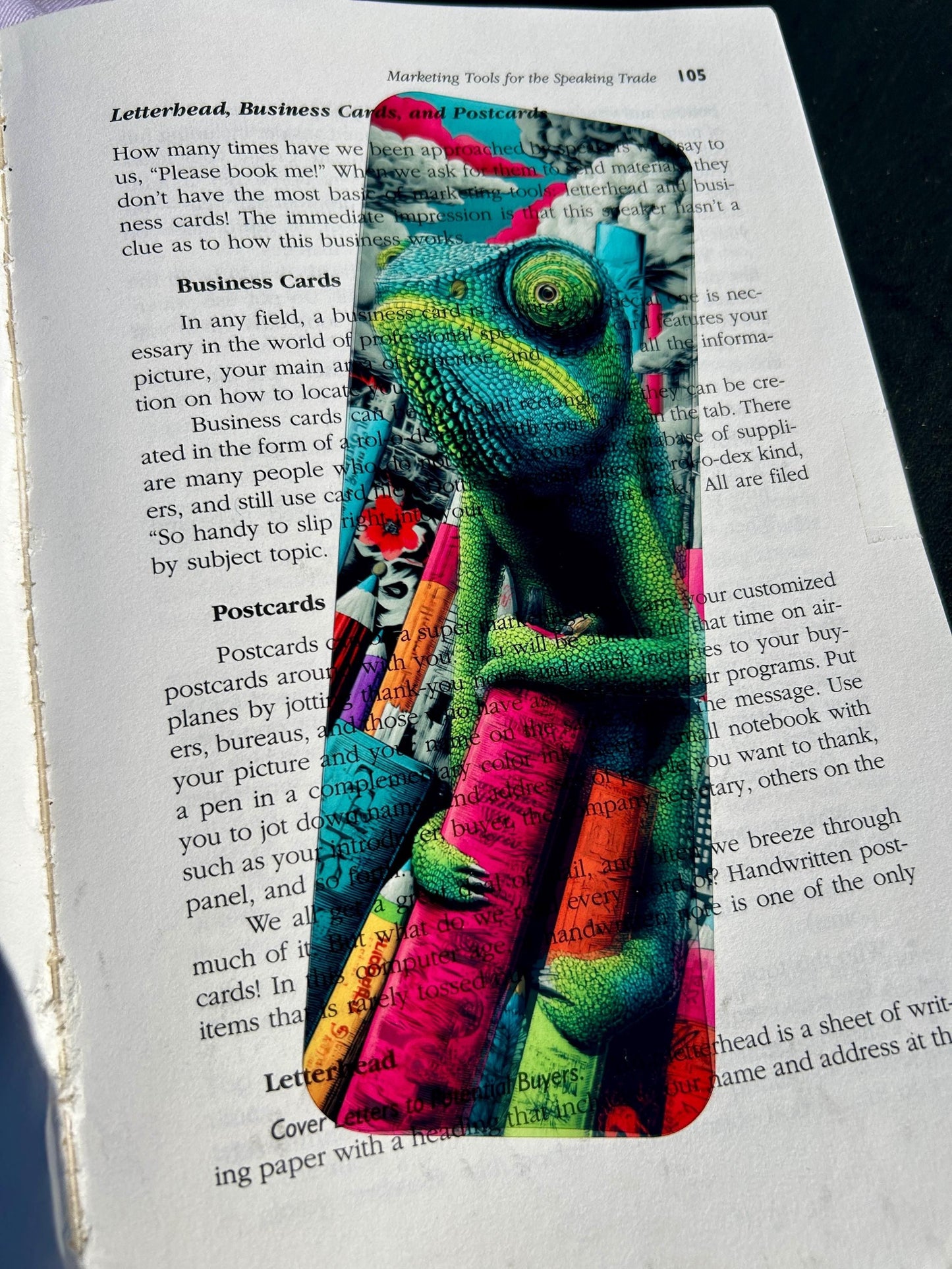 Chameleon Bookmark on Surreal Books and Charcoal Sky – Vibrant Fantasy Art for Creative Readers, Artists